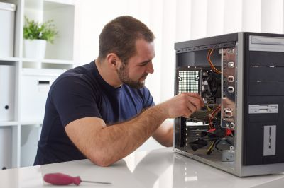 Technician performing installation on a desktop